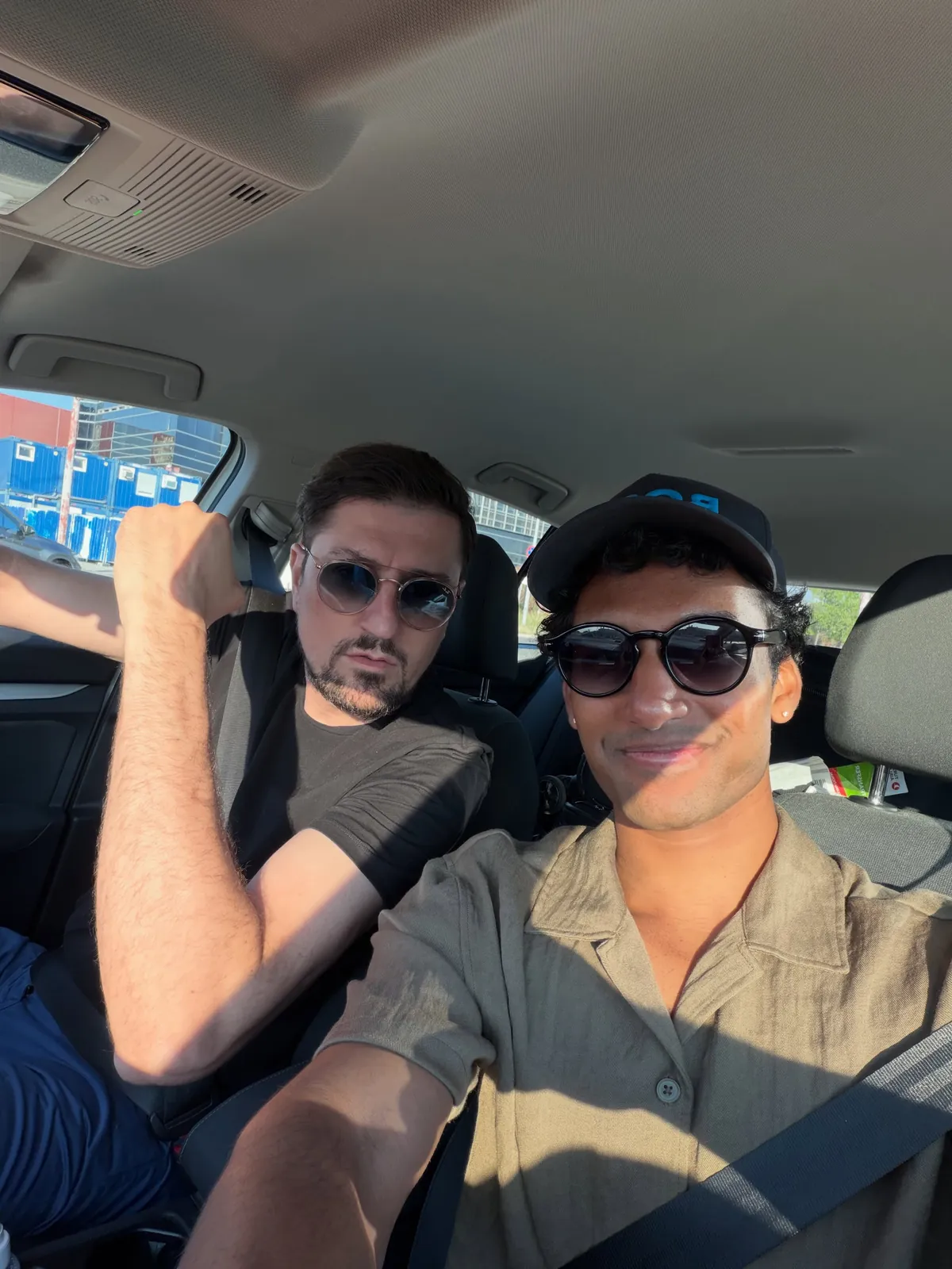 Sai in a car wearing sunglasses