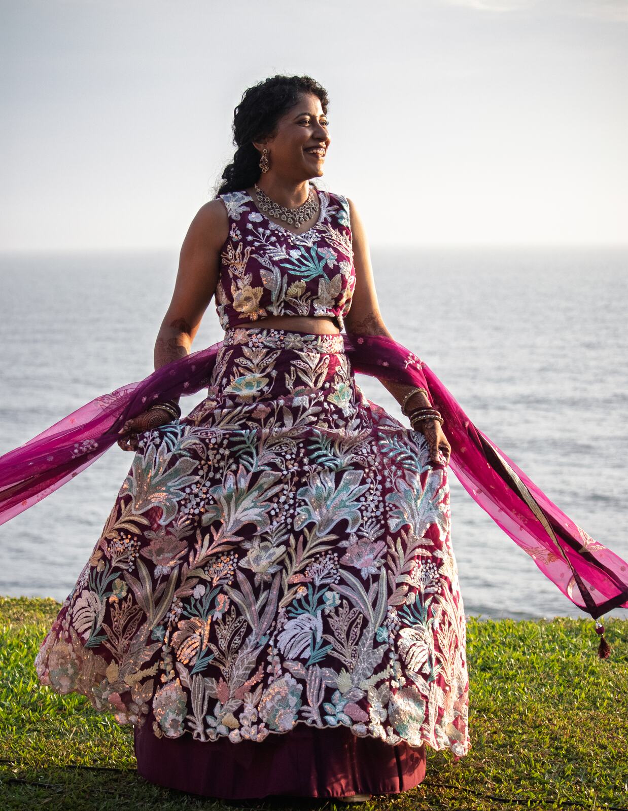 Manju twirling her lehenga on the cliffs in Varkala